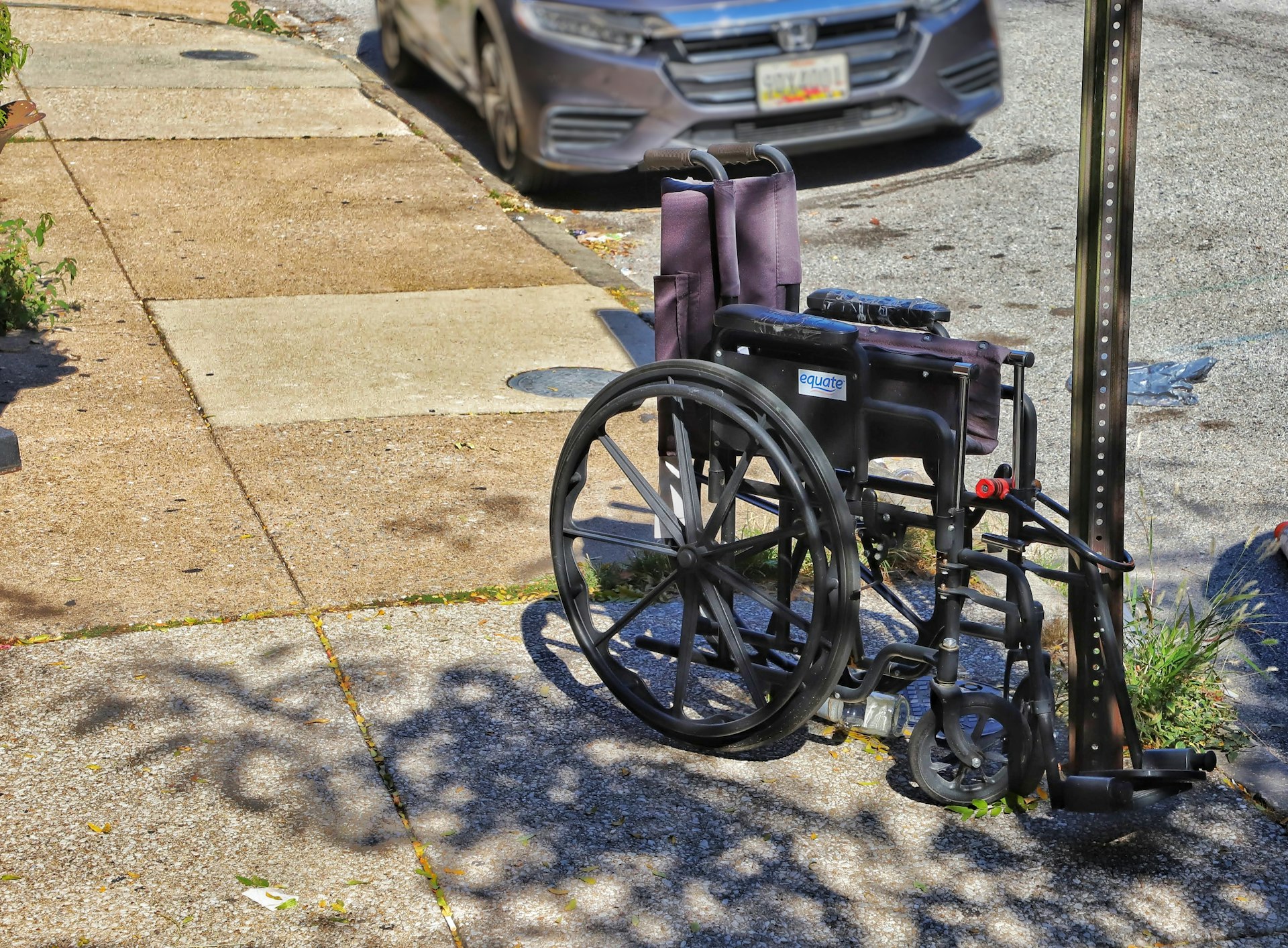 a wheelchair parked on the side of the road